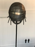 Paolo Fiorellini, maschera "Pesce", Ecce Homo, alluminio e tela di iuta, 30x180