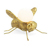 Abhika, lampada da tavolo Bee, metallo oro e vetro bianco, 31x30x20 cm